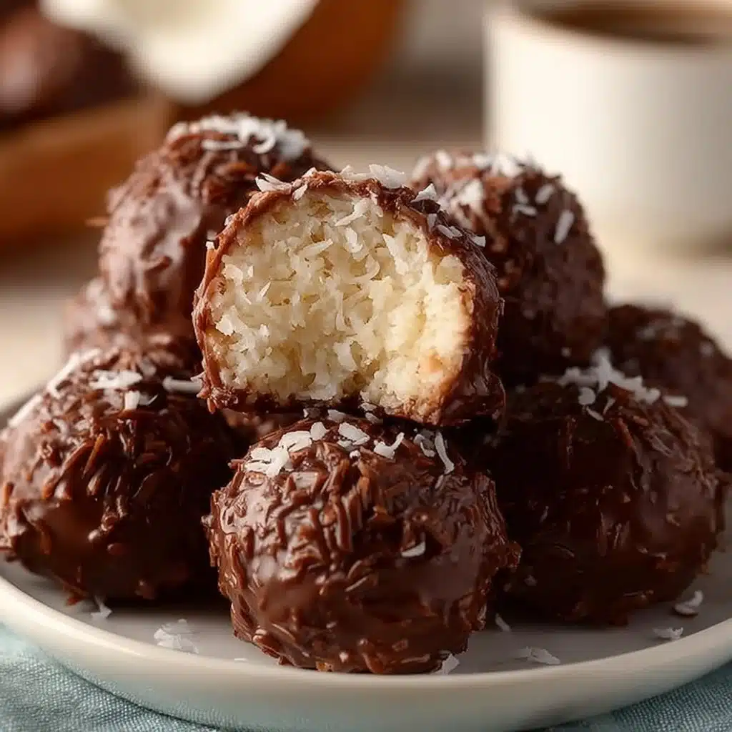 Almond Joy Coconut Bites 3 Almond Joy Coconut Bites in a wrapper showcasing chocolate and coconut layers